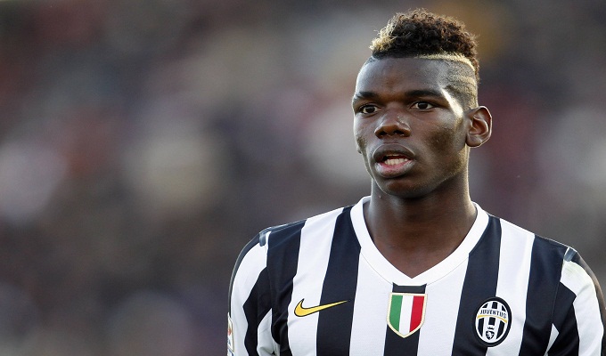 Juventus' Pogba looks on during their Italian Serie A soccer match against Livorno in Livorno