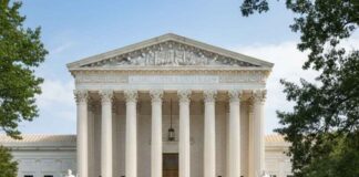 Cour suprême USA : Décision sur les taxes douanières et séparation des pouvoirs Photographie de la façade de la Cour suprême des États-Unis avec les colonnes de marbre, symbolisant le pouvoir judiciaire